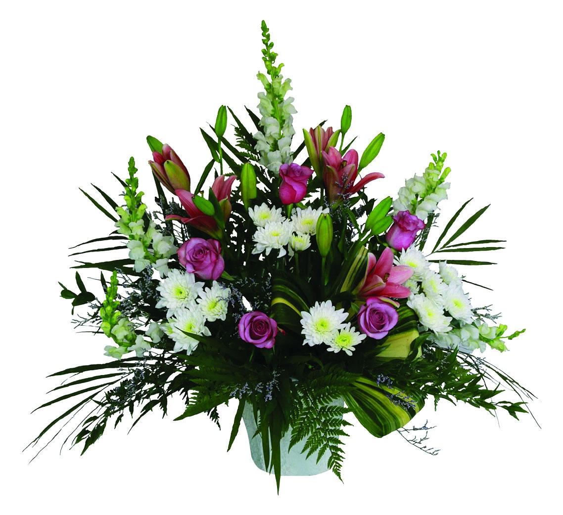 An arrangement with white snapdragons and chrysanthemums, pink roses and lilies and greens.